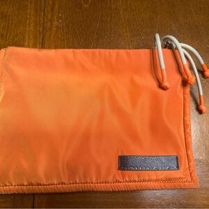 adolfo dominguez orange pouch makeup bag clutch stylish functional trendy